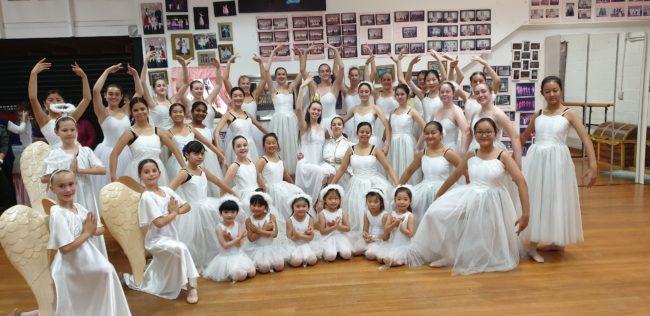 Graceful ballerinas in a magical dream production