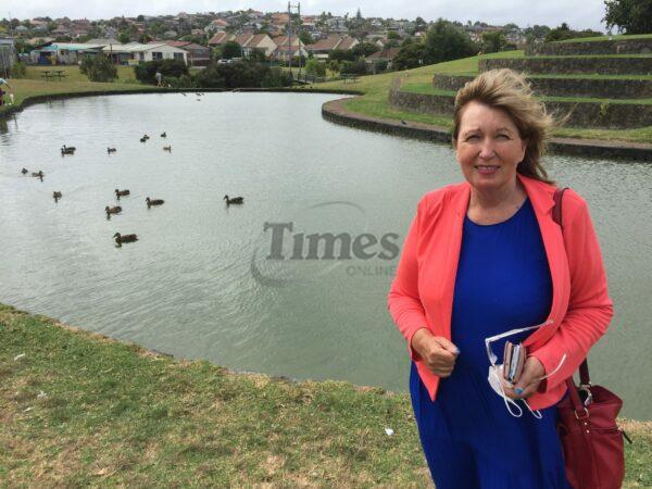 Rubbish dumped in polluted pond