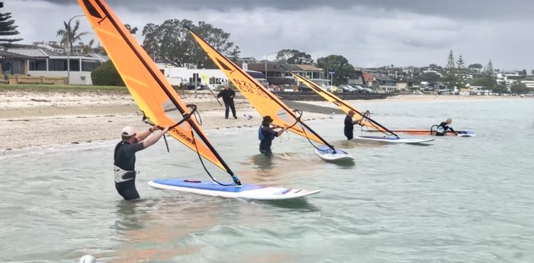 International board sailors racing in Auckland